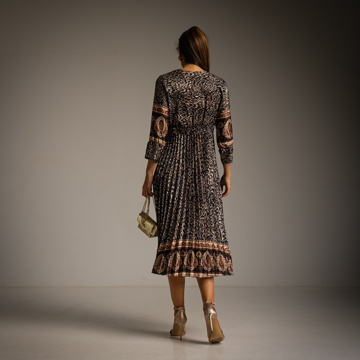 Black paisley print pleated midi dress with wrap neckline and balloon sleeves - back view