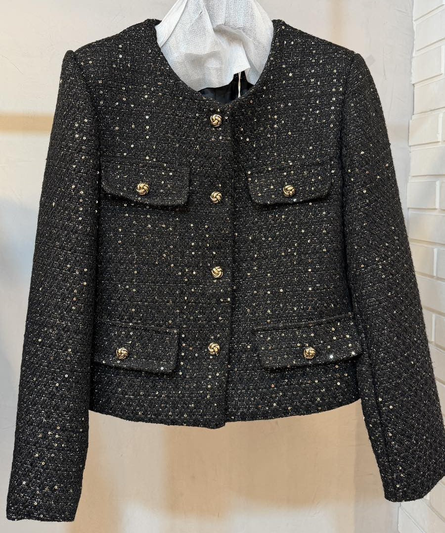 Black sequin tweed jacket with gold knot buttons and four flap pockets - front view
