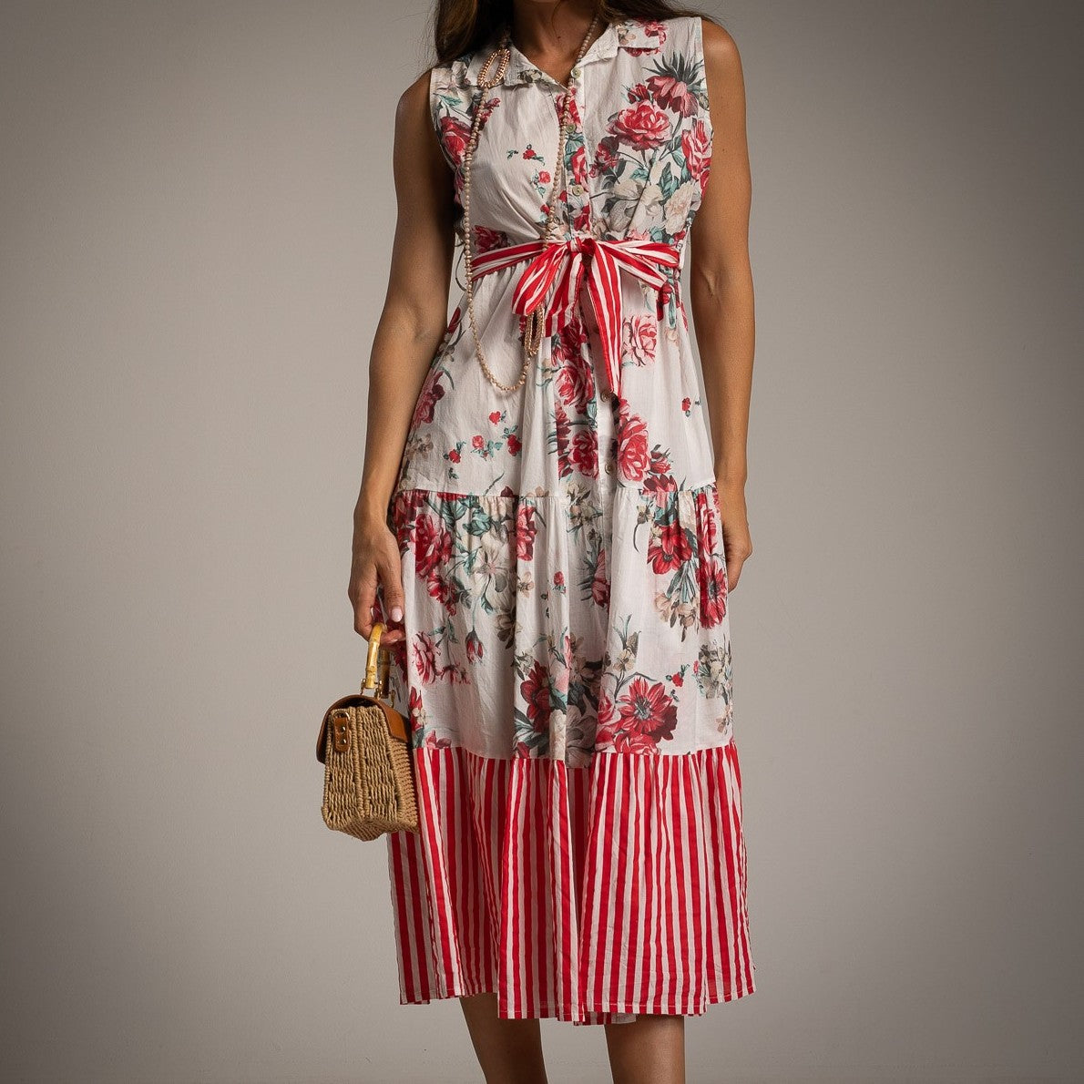 Close-up of MARIΓIOÚ floral cotton shirt dress in Poppy Red with striped waist tie