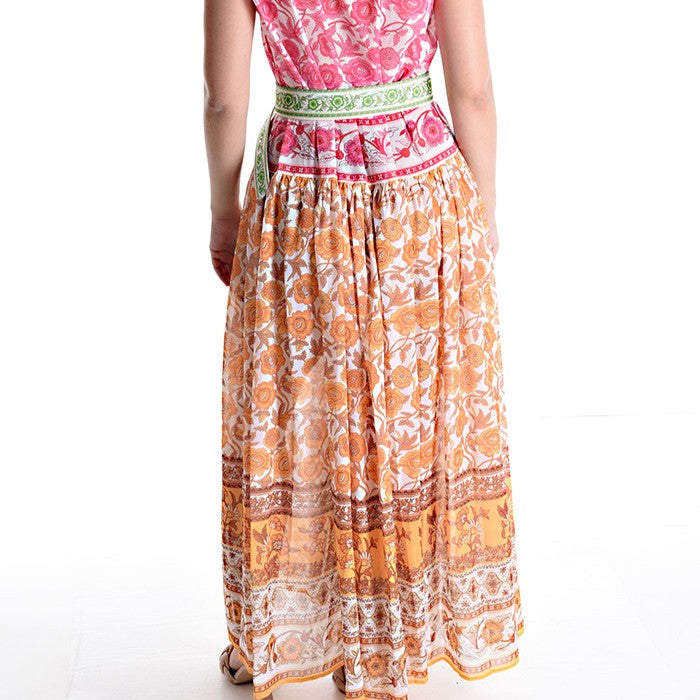 MARIΓIOÚ flowing floral resort maxi dress with belted waist and warm Mediterranean tones rear view