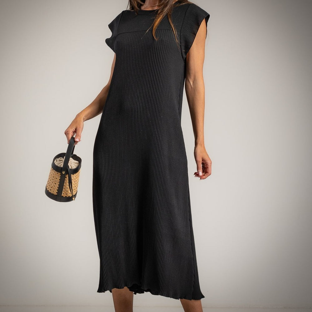 Front detail of black micro pleated midi dress with textured pleated fabric