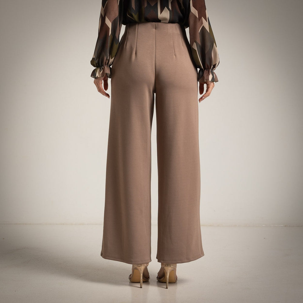 Almond Taupe high-waisted flared trousers with a pressed centre seam - back view