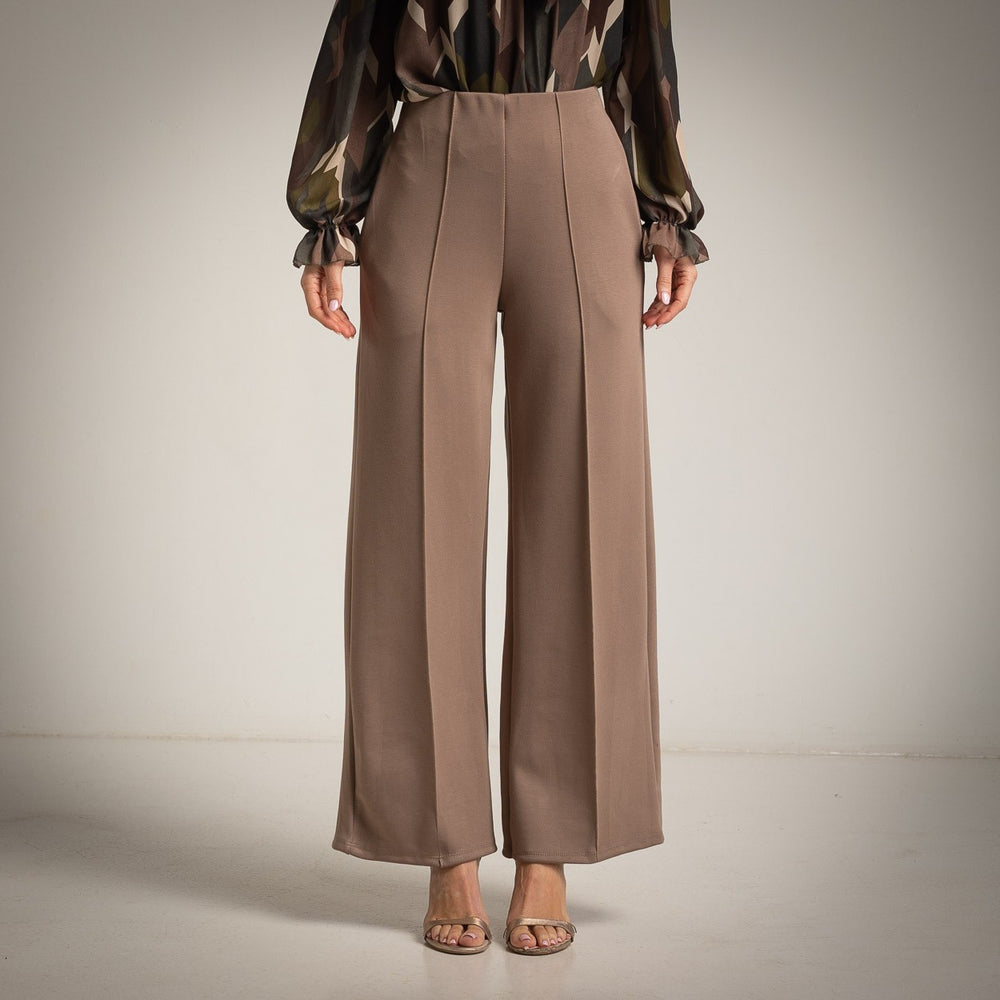 Almond Taupe high-waisted flared trousers with a pressed centre seam - front view