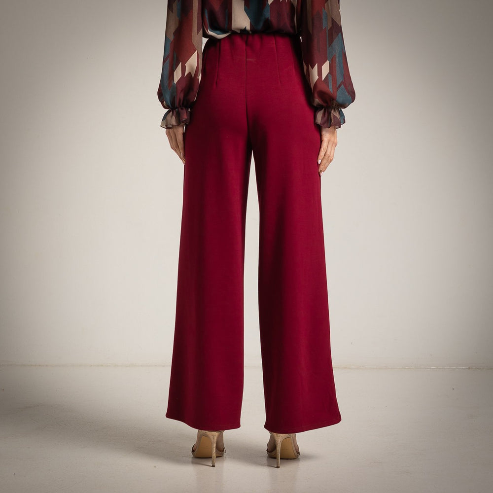 Deep Wine Red high-waisted flared trousers with a pressed centre seam - back view