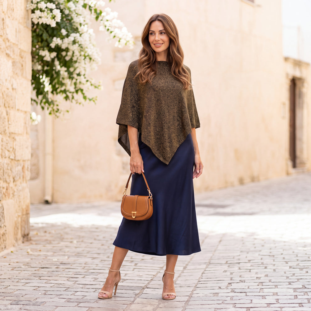 Black asymmetric lurex poncho with shimmering metallic knit by MARIΓIOU