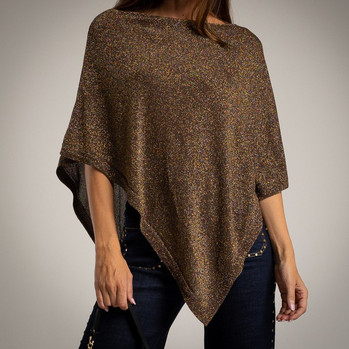 Brown asymmetric lurex poncho with shimmering metallic knit - front view