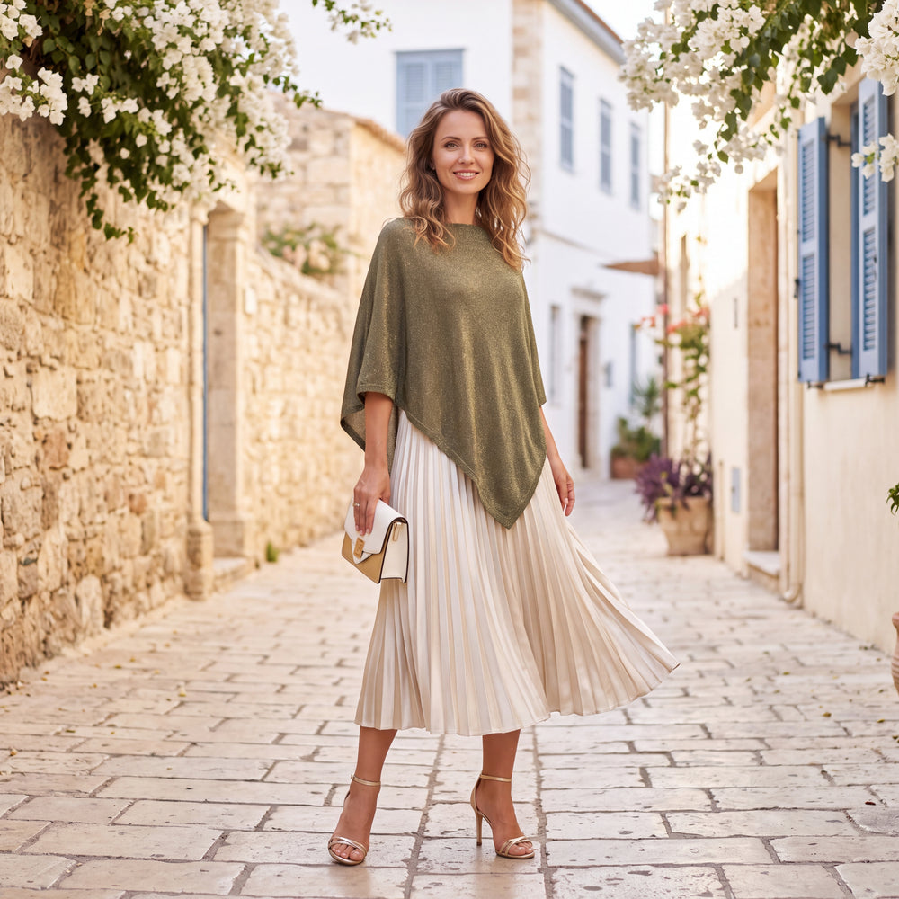 Olive Grove asymmetric lurex poncho with shimmering metallic knit by MARIΓIOU