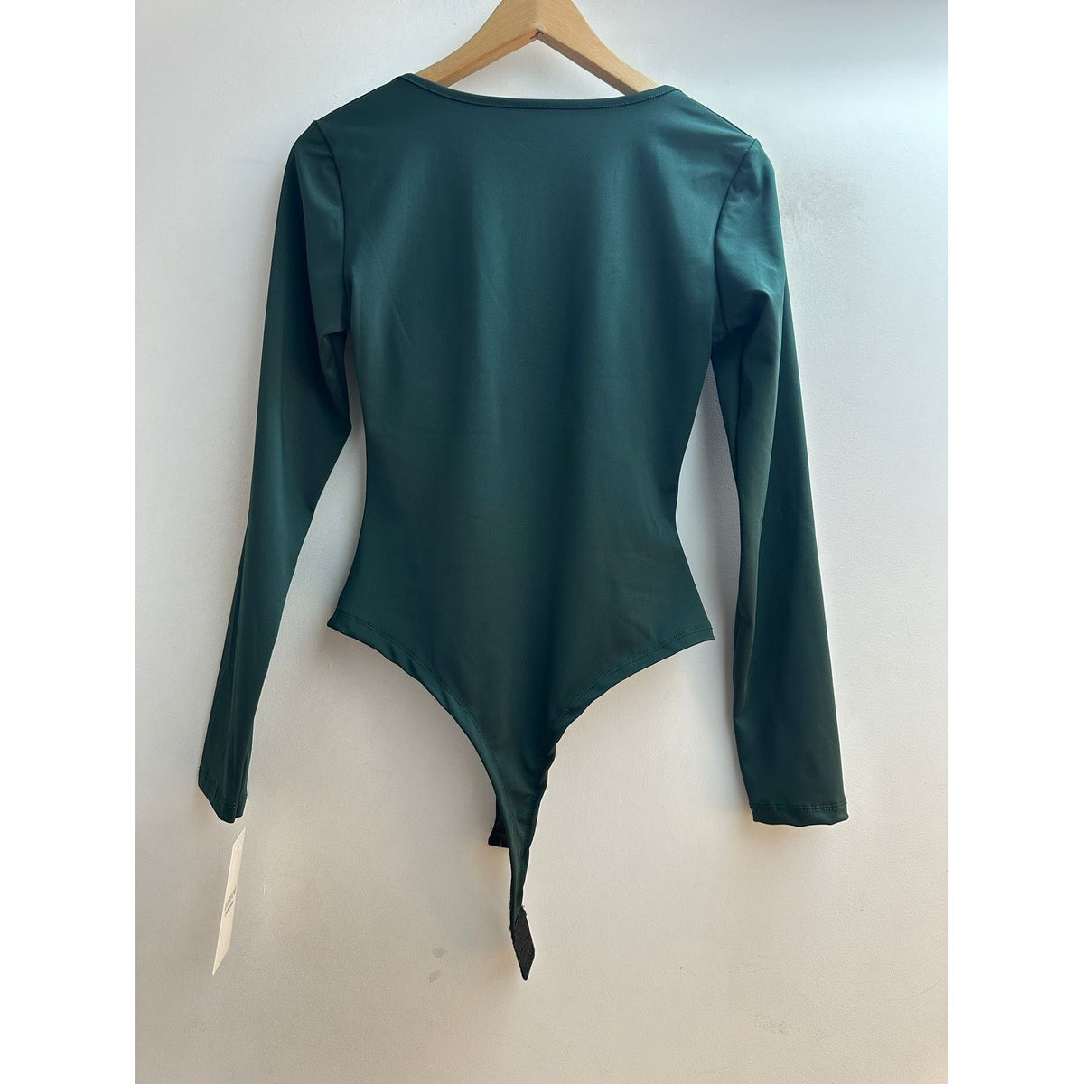 Emerald Oasis long sleeve bodysuit with V-neck and gold ring twist front - back view