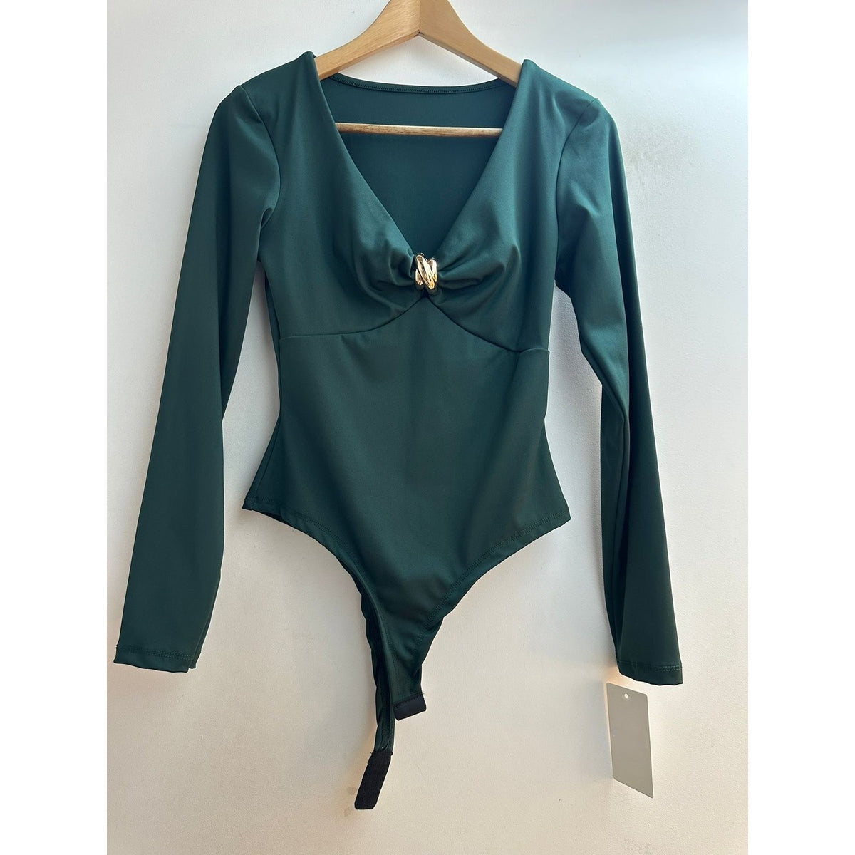 Emerald Oasis long sleeve bodysuit with V-neck and gold ring twist front - front view