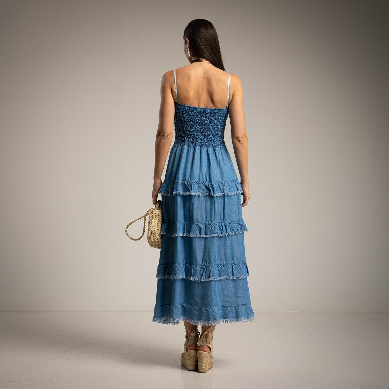 Back view of Ocean Blue denim look maxi dress with layered frayed details