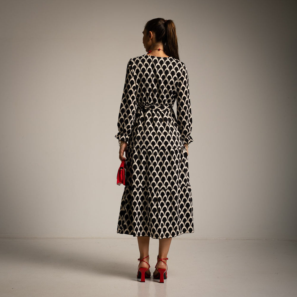Black fish scale print wrap midi dress with tie waist and ruffled cuffs - back view