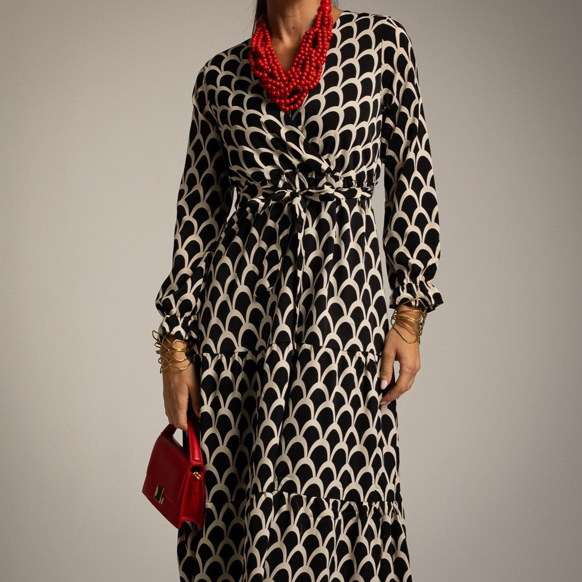 Black fish scale print wrap midi dress with tie waist and ruffled cuffs - front view