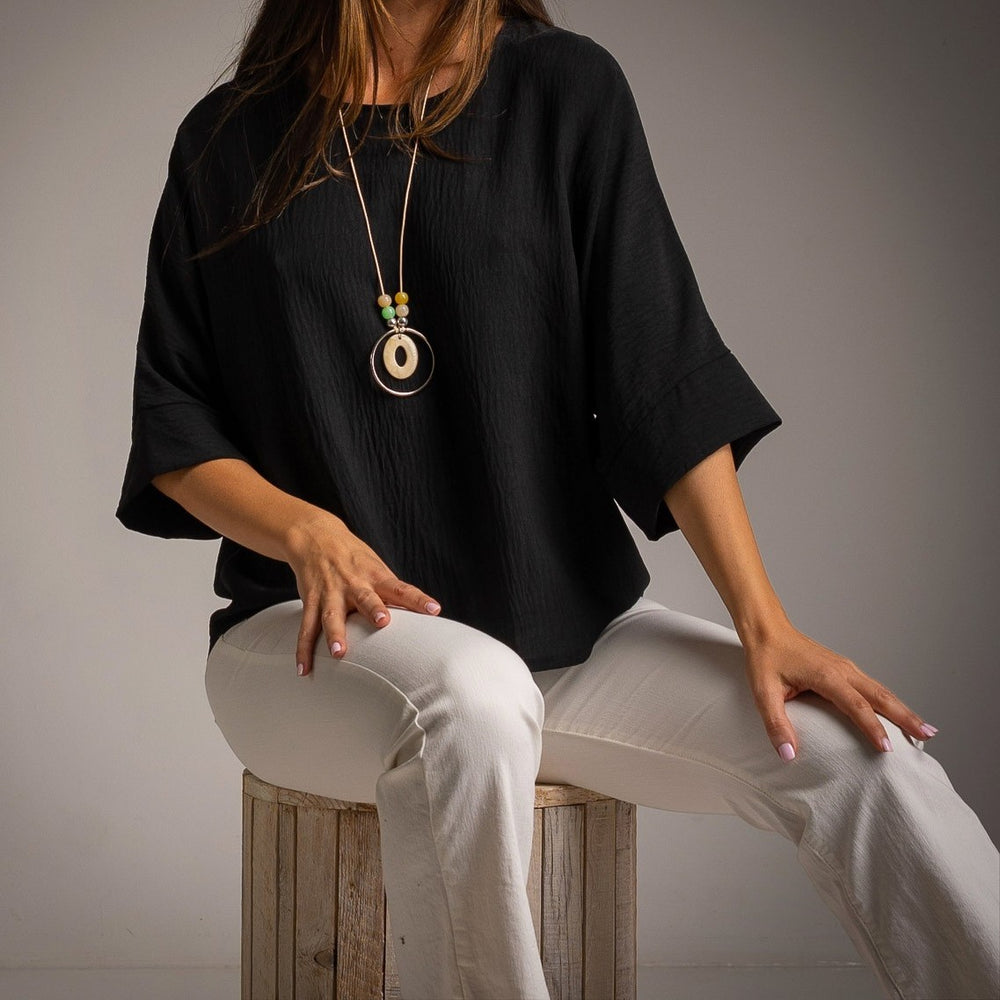 Black oversized one size shirt close look soft fabric and wide sleeves