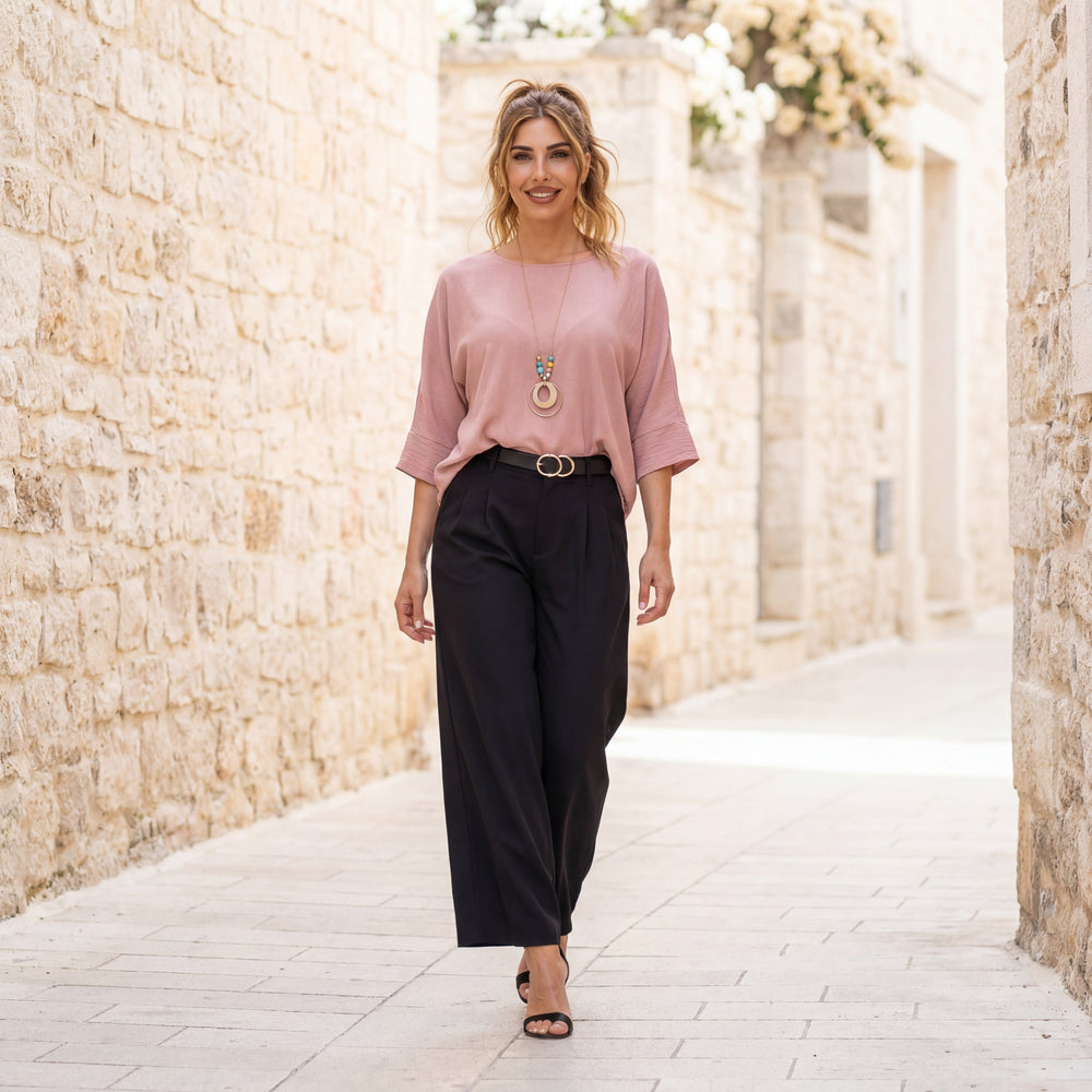 Rose oversized shirt by MARIΓIOÚ styled with black trousers elegant street look