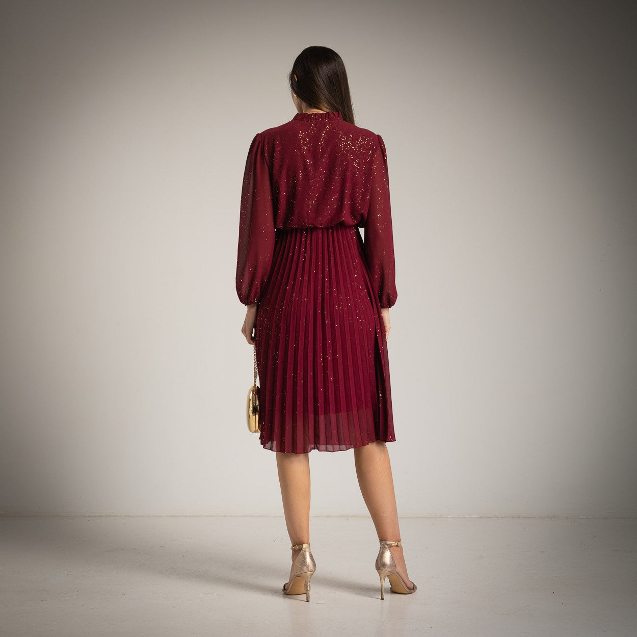 Burgundy glitter pleated midi dress by MARIΓIOÚ, back view