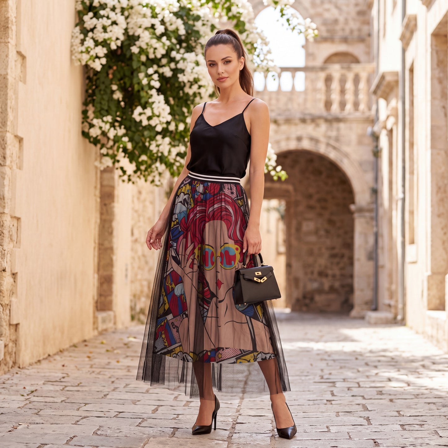 Woman wearing the Pop Art Statement Tulle Skirt styled with a black camisole in a Mediterranean street.