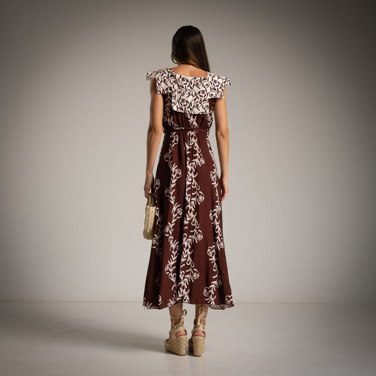 Cocoa Brown block print midi dress with white ruffle collar and flowing skirt - back view