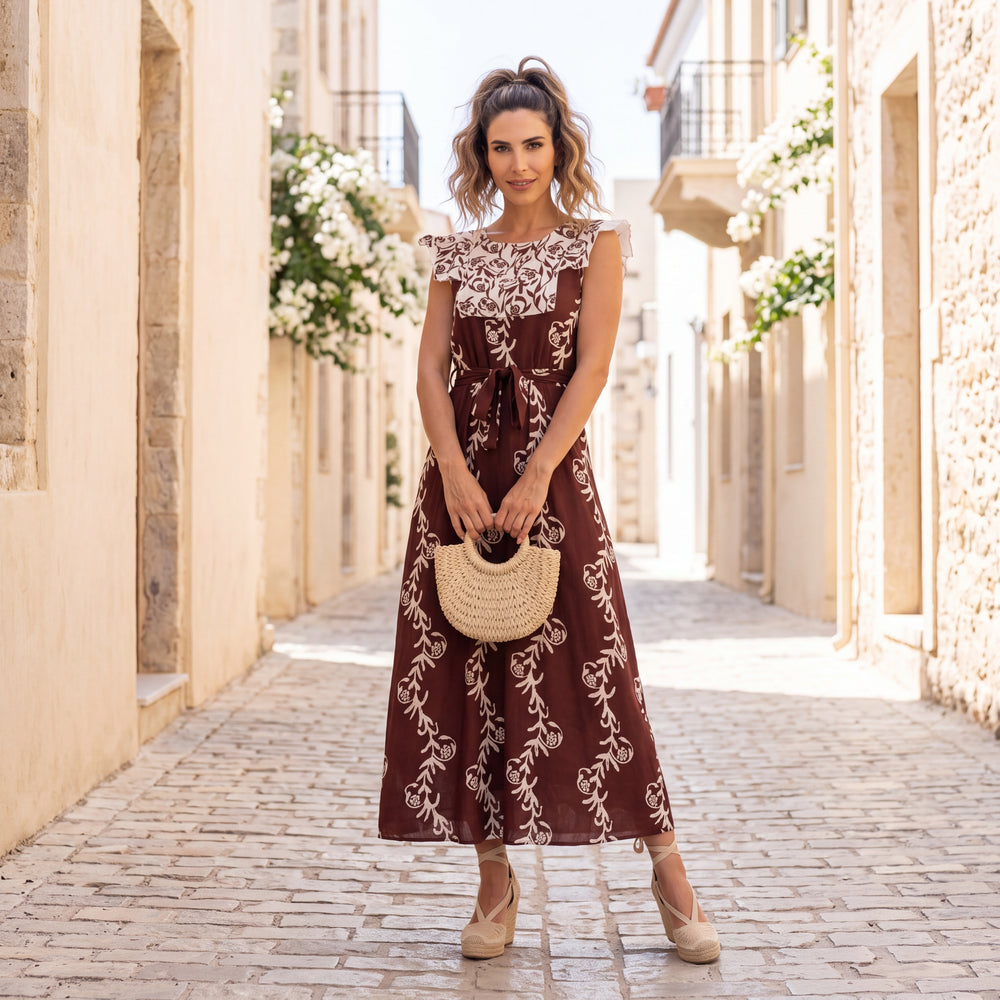Cocoa Brown block print midi dress with white ruffle collar and tie waist, worn in a Mediterranean village lane by MARIΓIOÚ