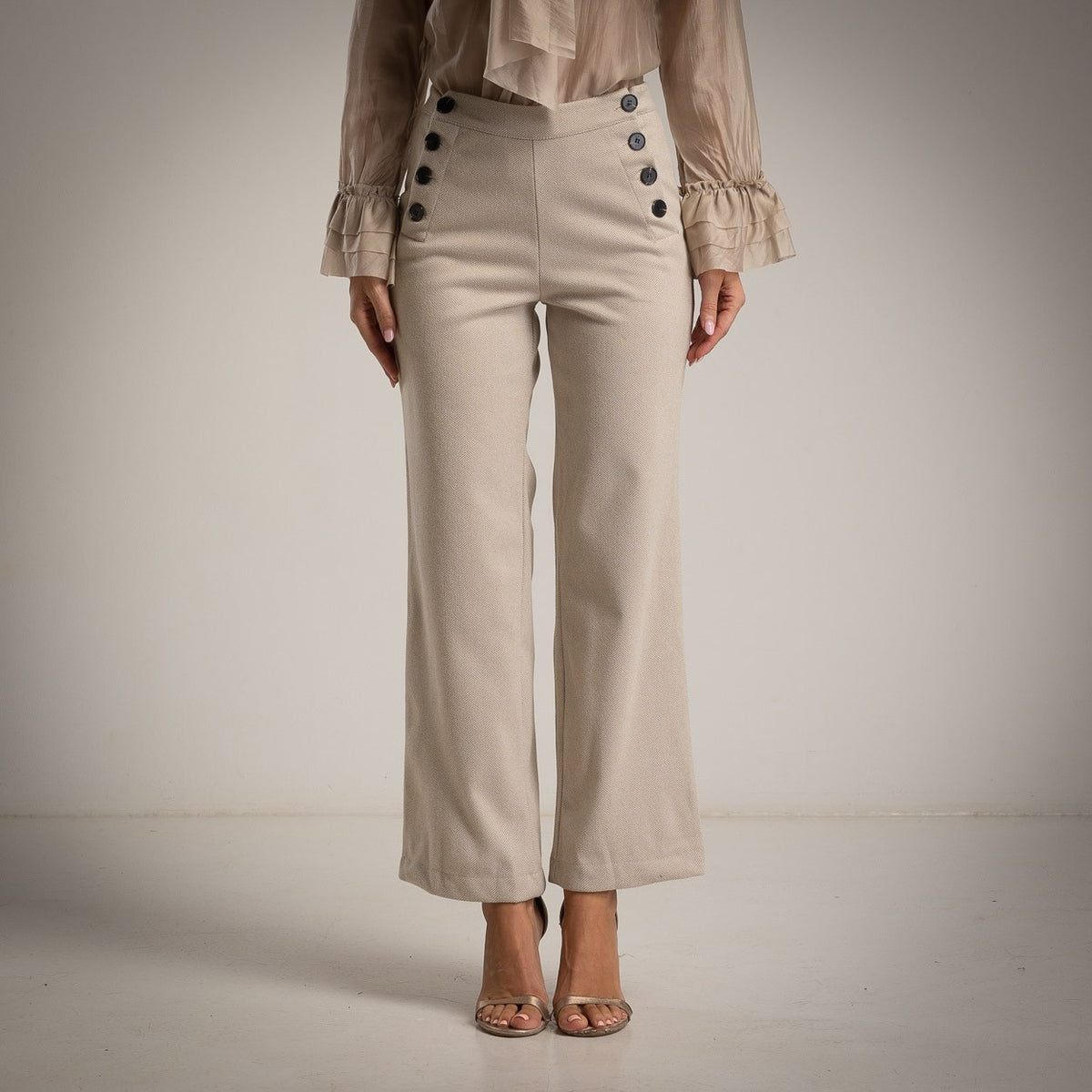 Latte Beige high-waist sailor trousers with decorative button front and flared leg - front view