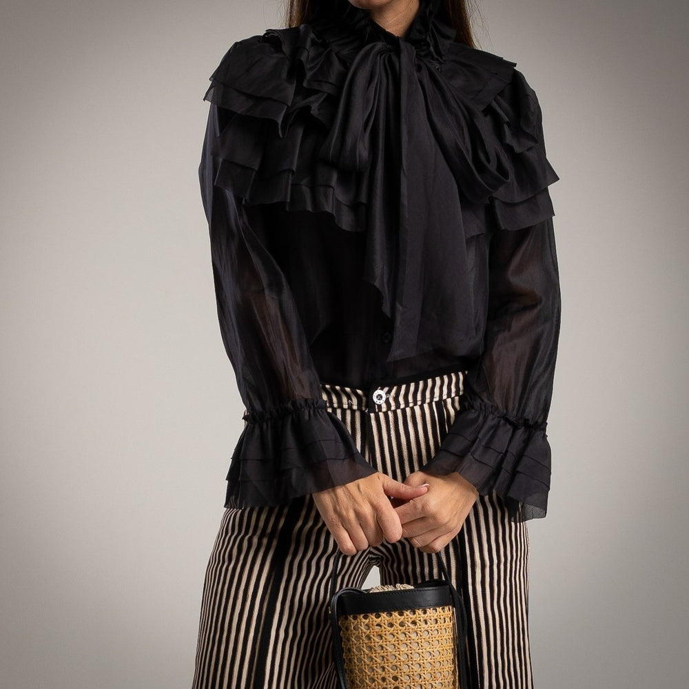 Black ruffle blouse with tie bow neck and flounced cuffs - front view