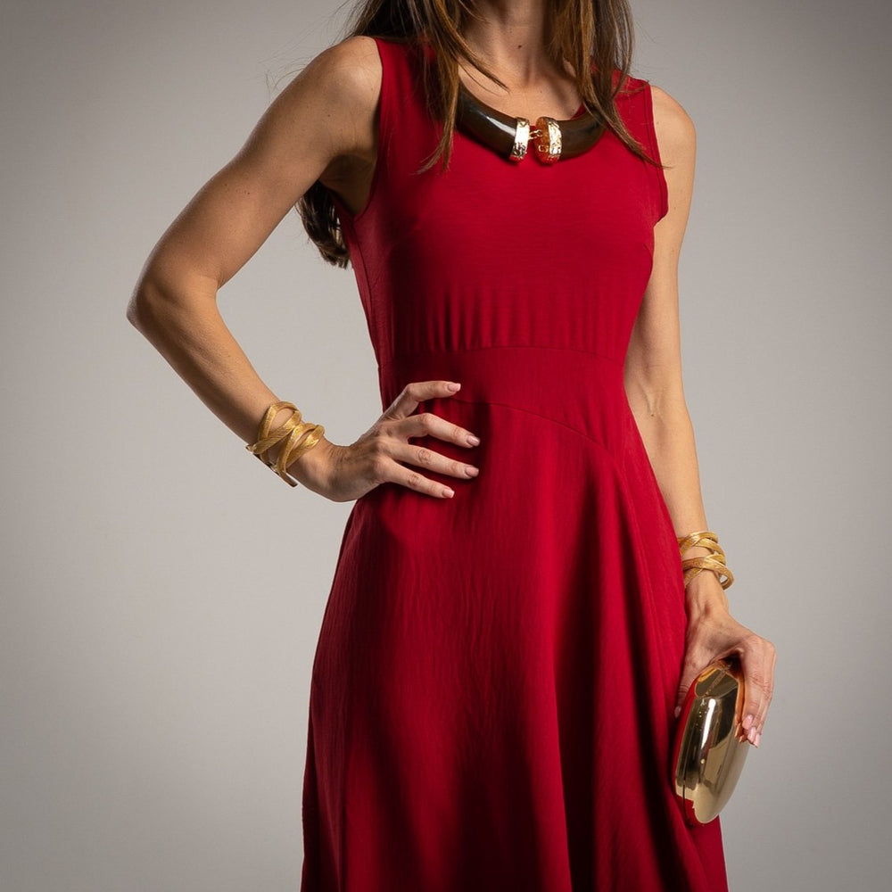 Ruby Red sleeveless midi dress with flowing skirt and flattering asymmetrical cut