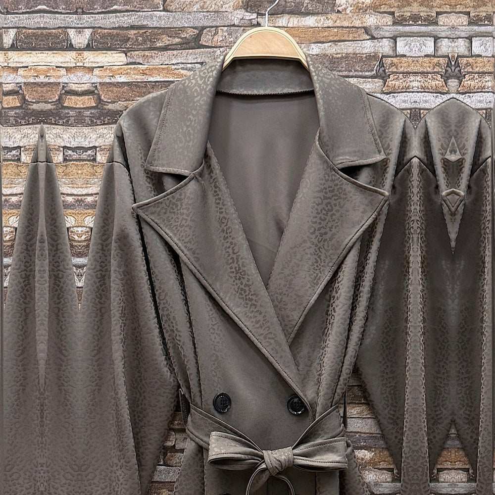 Almond Taupe embossed leopard trench coat with wide lapels and tie belt - detail view