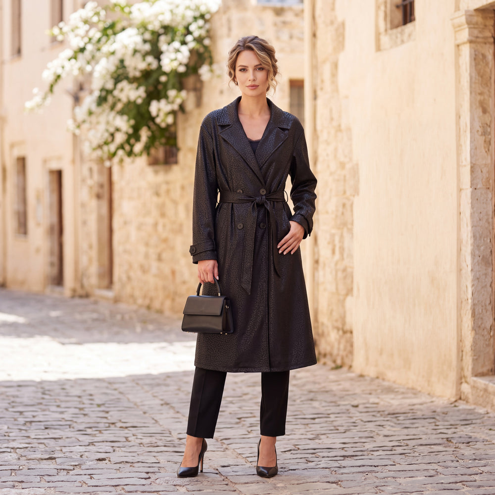 Black embossed leopard trench coat with wide lapels and tie belt by MARIΓIOU