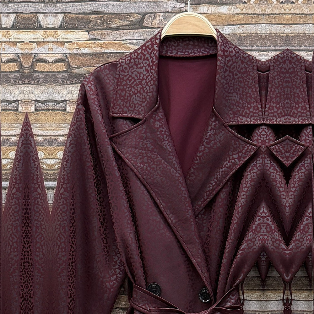 Deep Wine Red embossed leopard trench coat with wide lapels and tie belt - detail view
