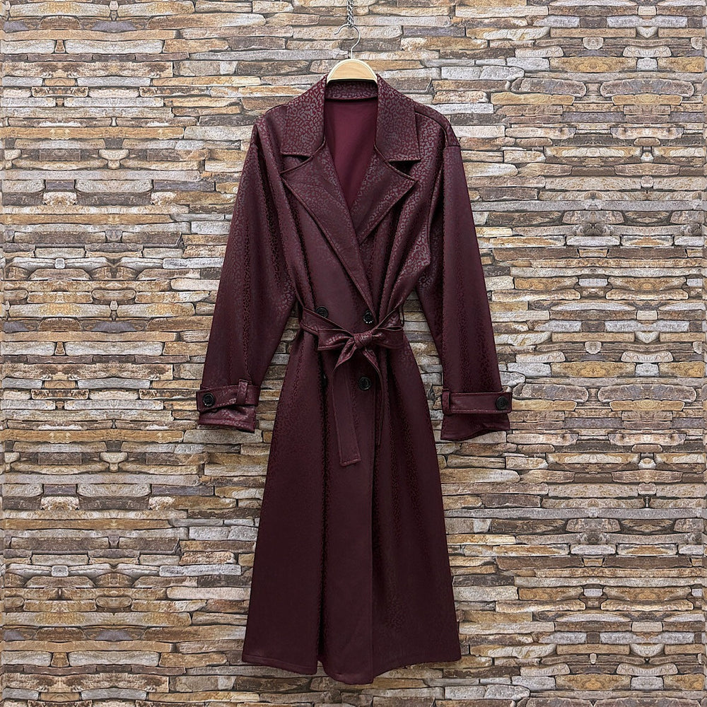 Deep Wine Red embossed leopard trench coat with wide lapels and tie belt - front view