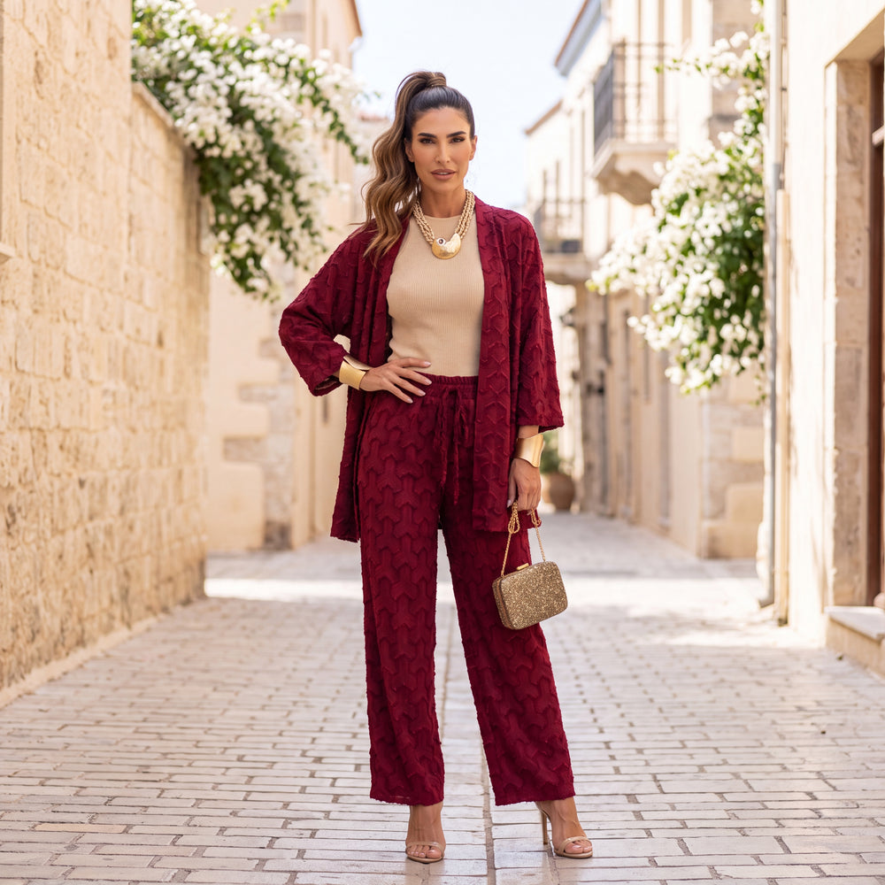 Woman wearing the Siena Textured Co-Ord Set in Deep Wine Red styled outdoors with an elegant autumn look.