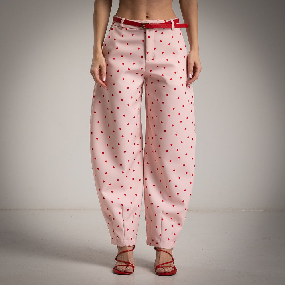 Soft blush pink polka dots balloon pants with matching belt and modern silhouette