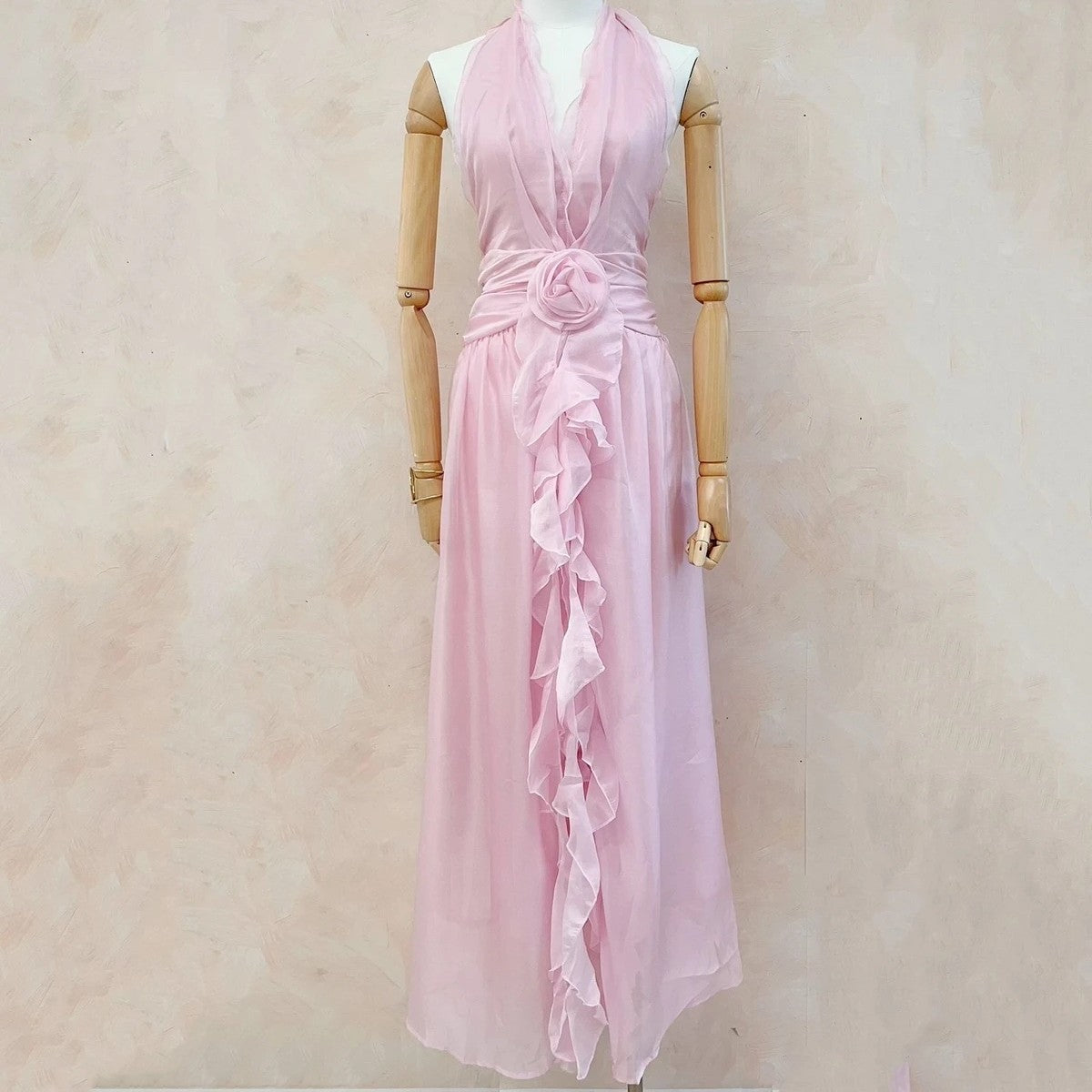 Soft blush rose halterneck chiffon maxi dress with floral waist detail front view