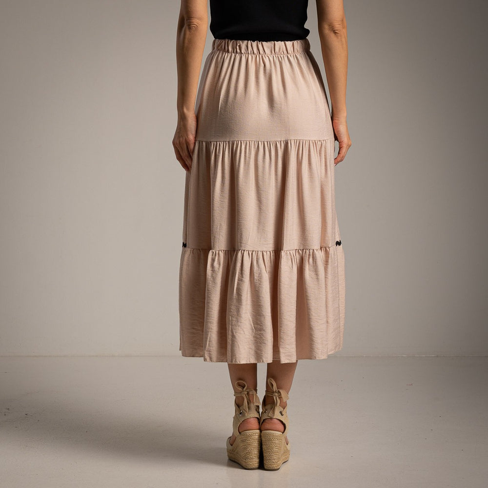 Soft sand beige flowy midi skirt with elastic waist back view
