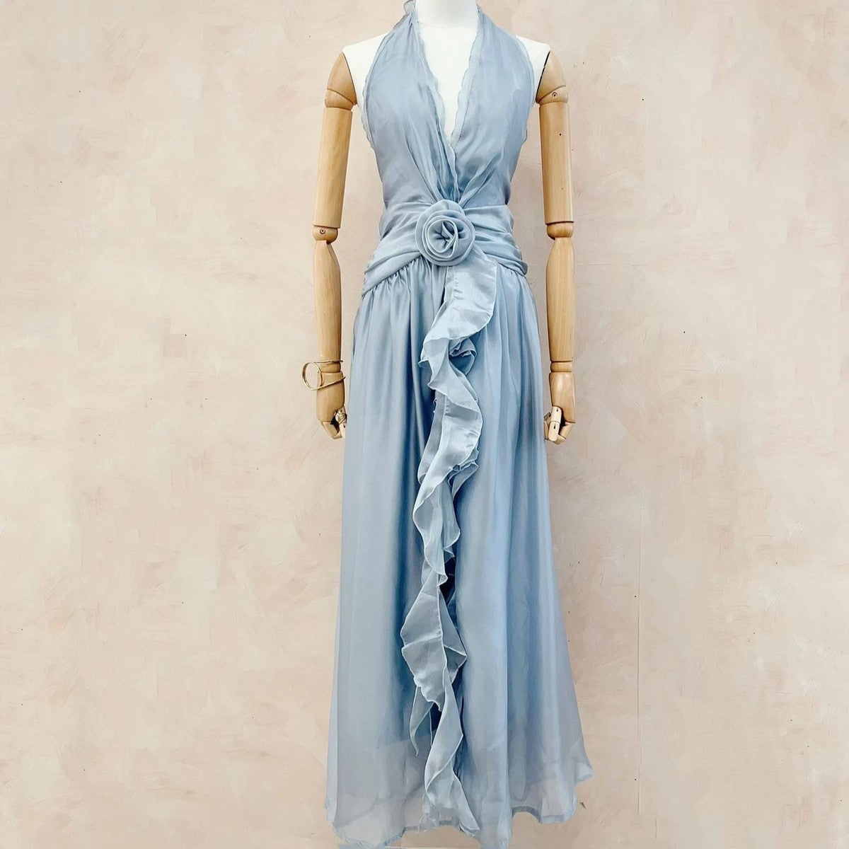 Soft blush rose halterneck chiffon maxi dress with floral waist detail front view