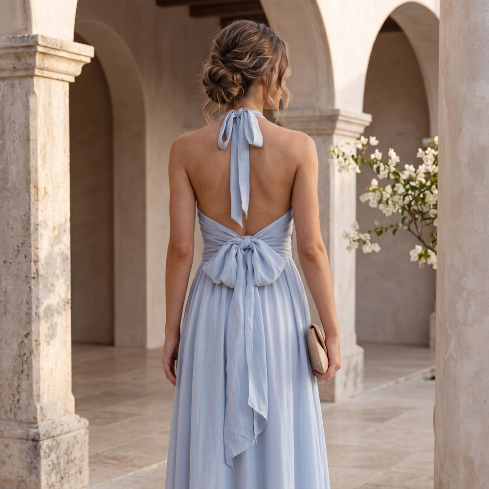 Back view of soft sky blue chiffon halterneck maxi dress with open back and bow tie
