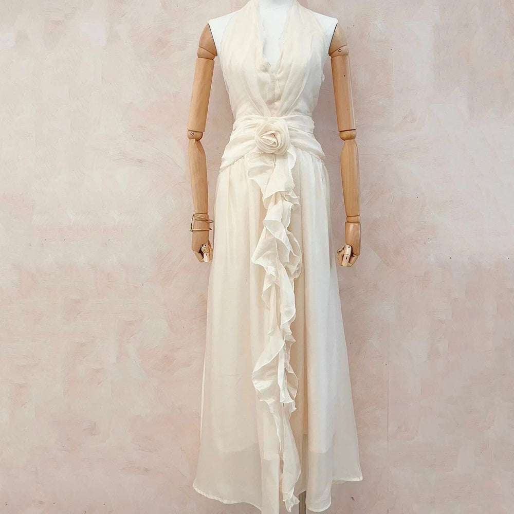 Soft vanilla cream halterneck chiffon maxi dress with floral waist detail front view