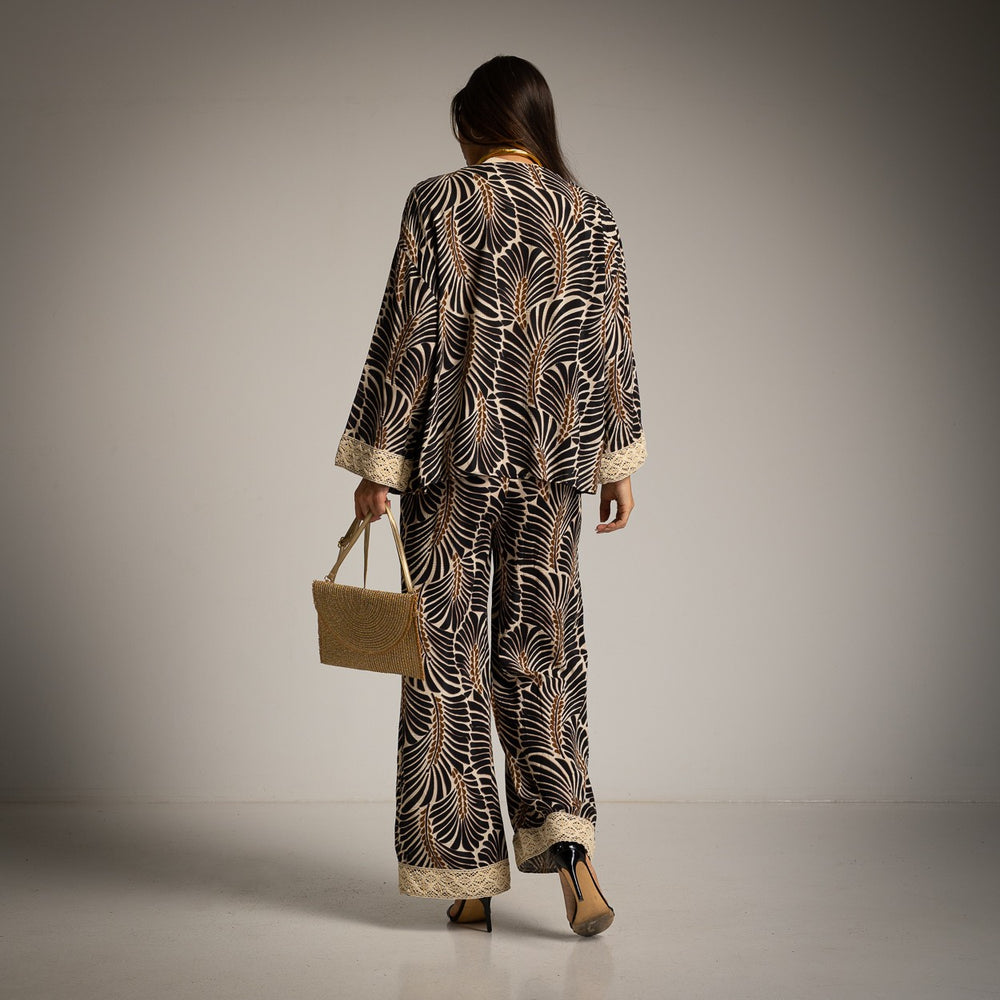 Back view of the Solea resort set with botanical print and lace trim