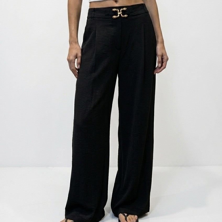 Black wide-leg trousers with pleated high waist and golden buckle - front view