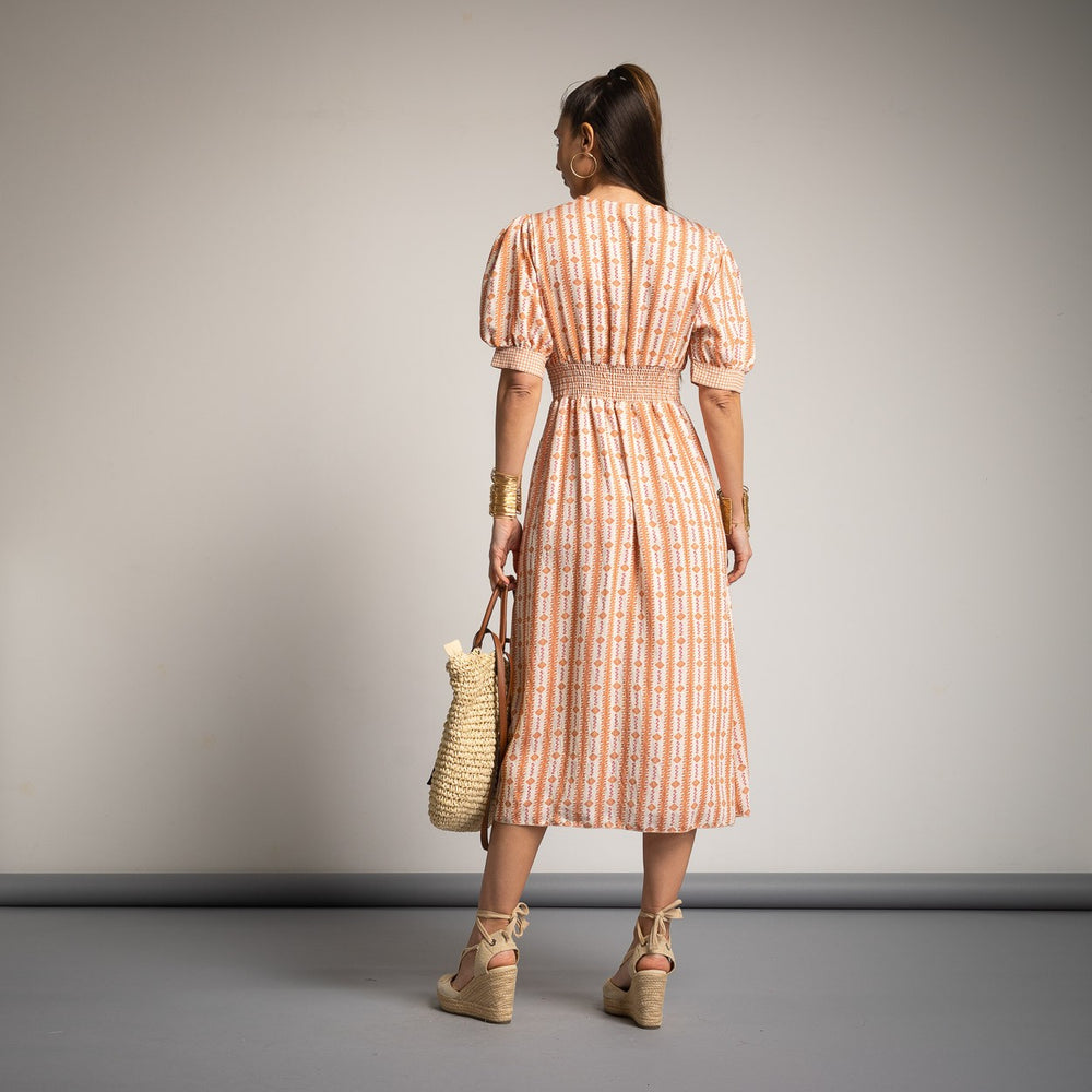 Back view of MARIΓIOÚ teja one size spring midi dress with elastic waist