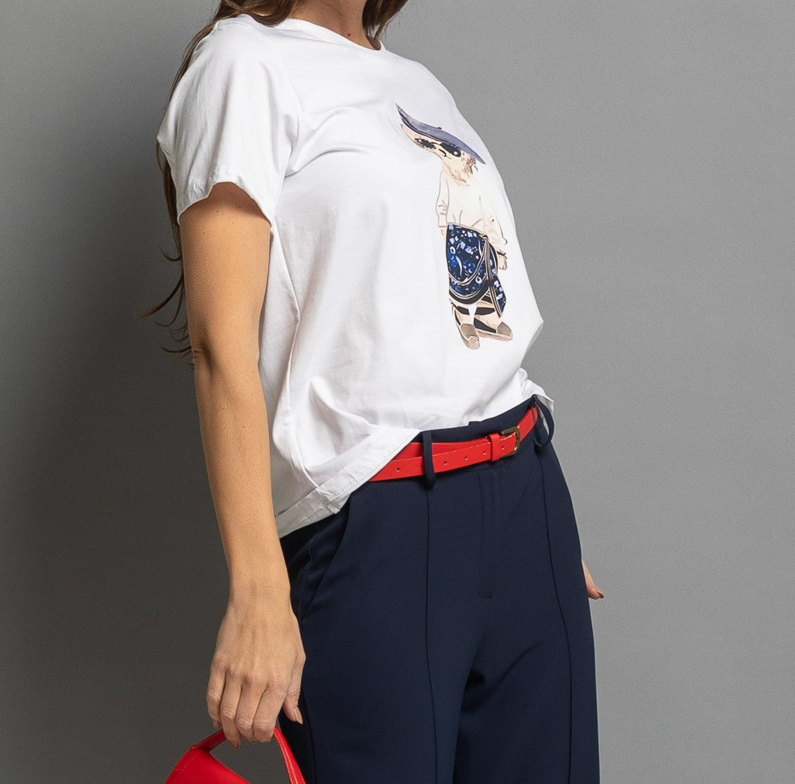 White graphic print T-shirt one size styled with red belt and navy trousers