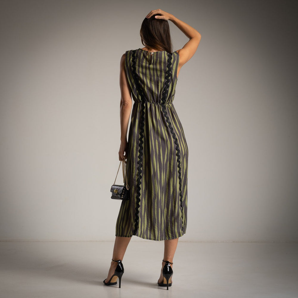 Back view of MARIΓIOÚ striped midi dress in green and black tones with elastic waist detail and sleeveless design