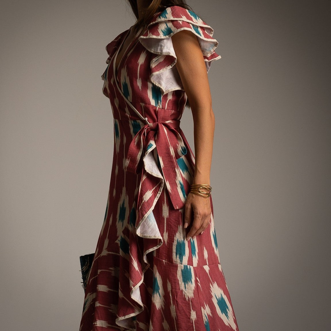 MARIΓIOÚ red ikat print midi dress with ruffle sleeves and side tie detail close up