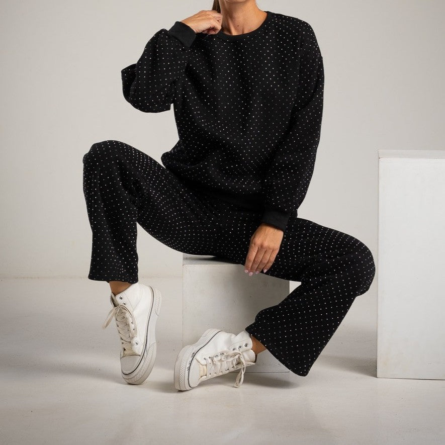 MARIΓIOÚ Swarovski loungewear set sitting pose close-up