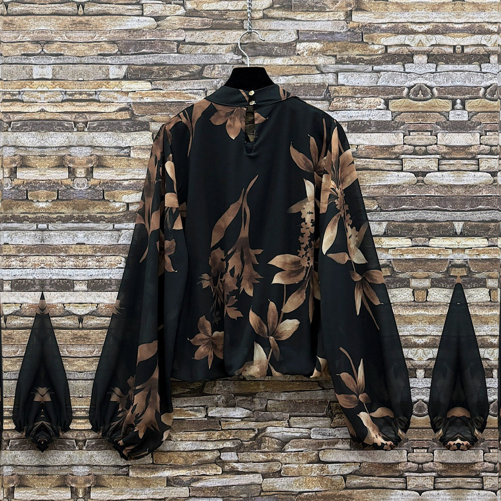 Black floral print blouse with sheer balloon sleeves and tie neckline - back view