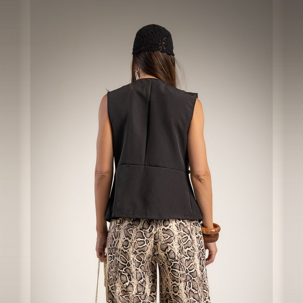 Black sleeveless military braid vest with gold buttons - back view