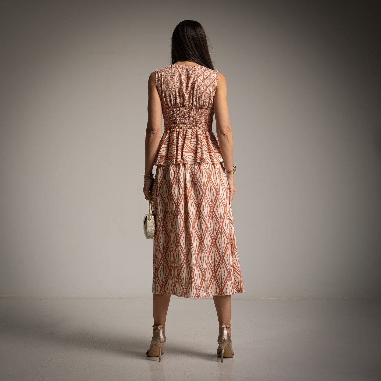 marigiou warm sunset bronze peplum midi dress back view