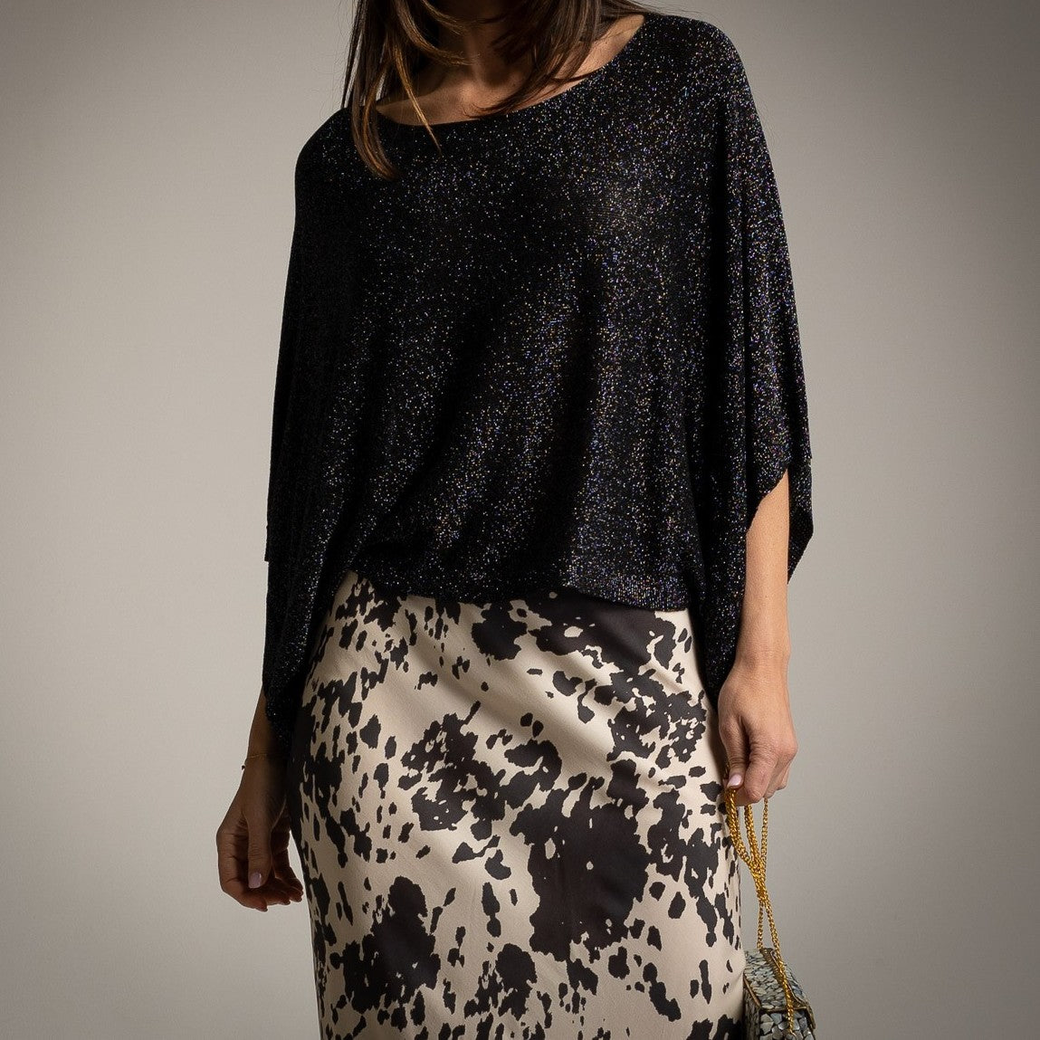 MARIΓIOÚ Shimmering Lurex Batwing Top in Black – front view