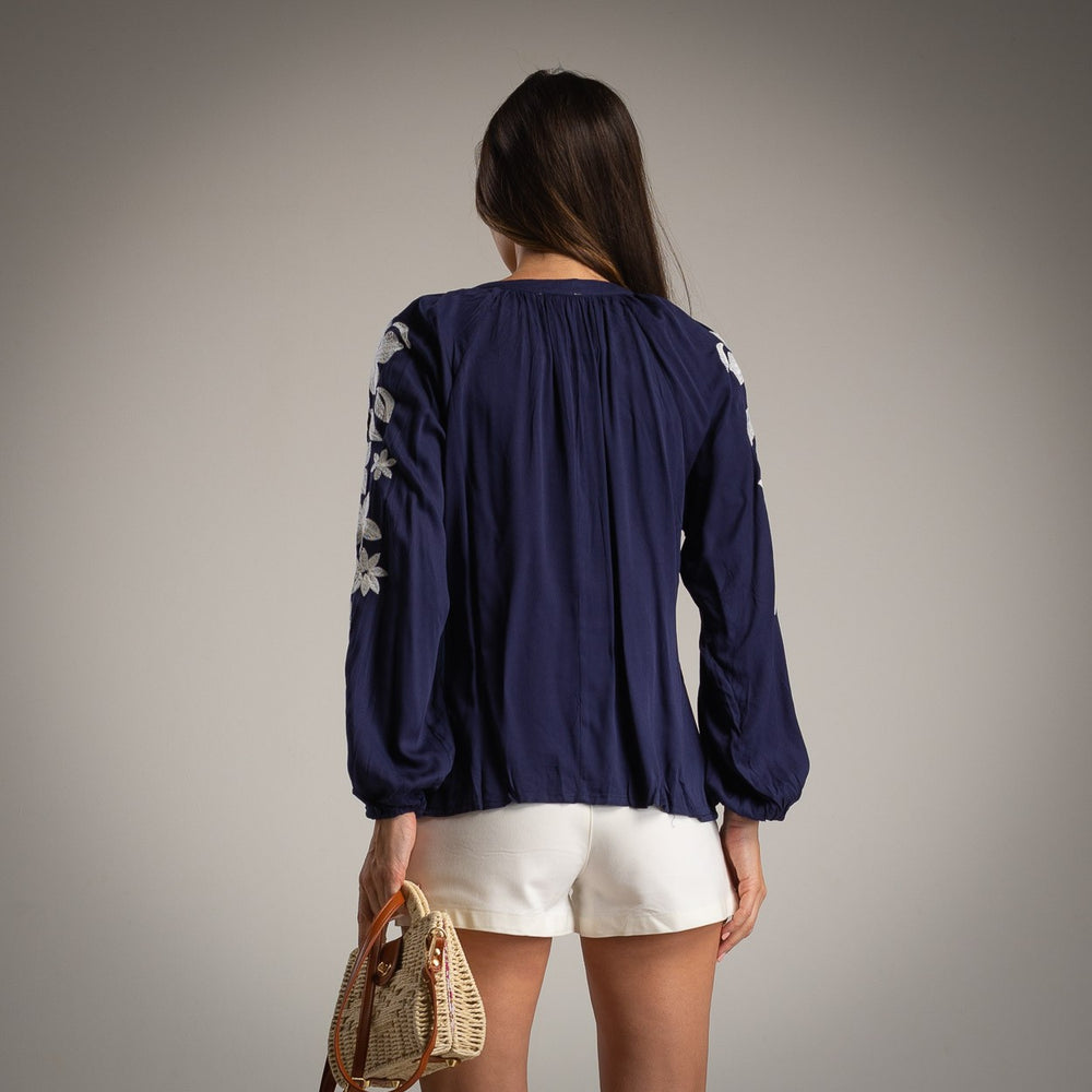 Navy embroidered blouse back view with long sleeves