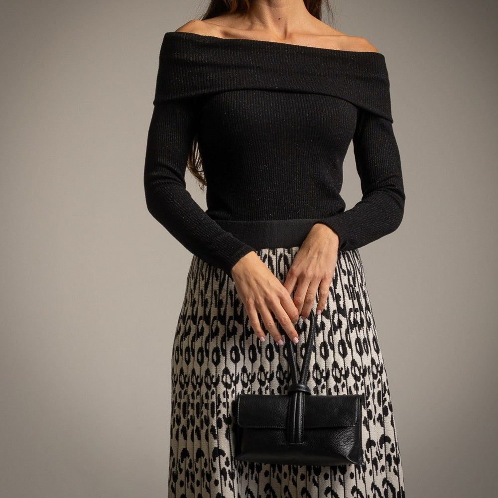 Black off-shoulder knit sweater with subtle shimmer effect