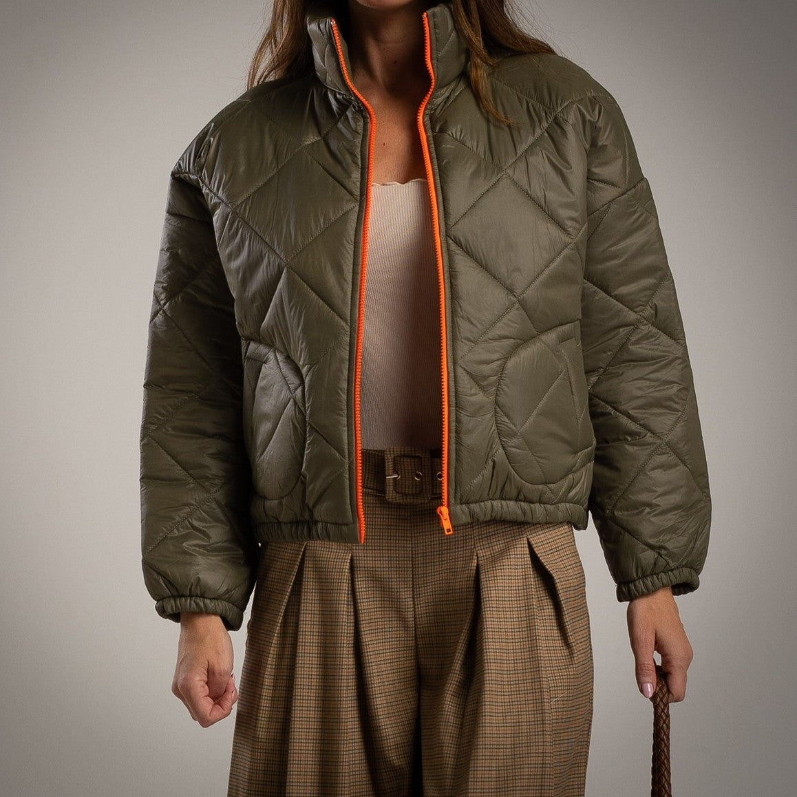 Olive padded jacket with fluorescent zipper – front view